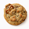 A single round chocolate chip cookie with pretzels and nuts, photographed on a plain white background. 